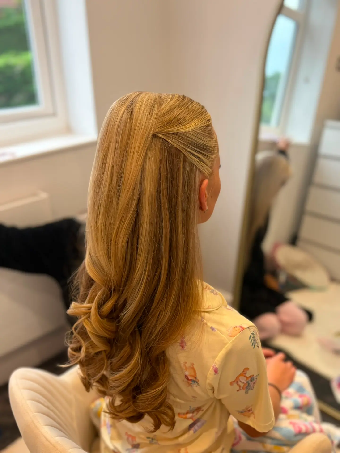 Half-up style with long bouncy curls